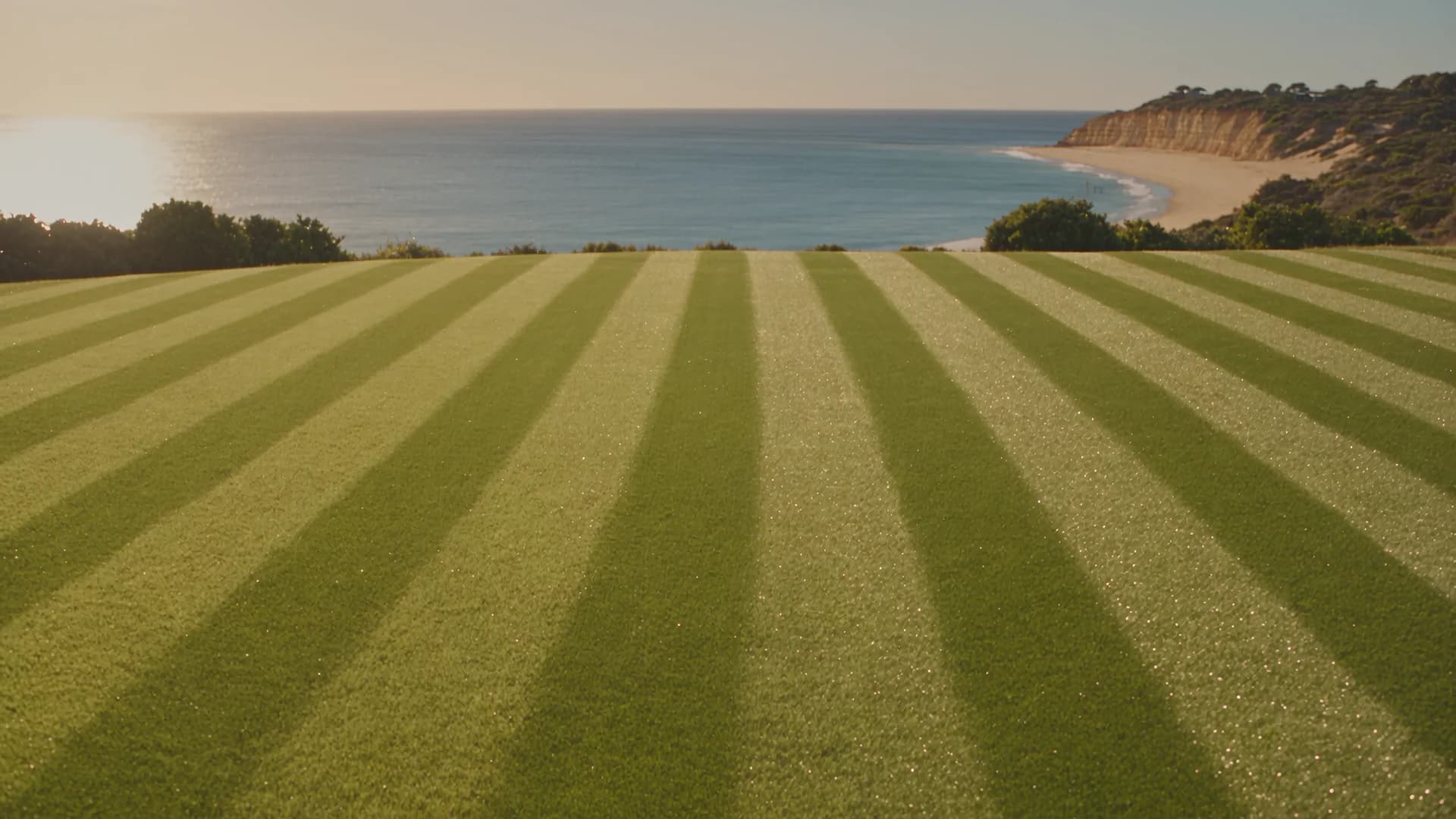 Freshly cut striped lawn overlooking the peninsula coastline
